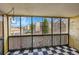 Bright sunroom overlooking the community featuring a checkered floor and large windows at 6980 E Girard Ave # 204, Denver, CO 80224