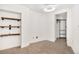 Small bedroom closet with wire shelving at 1617 California St # 3B, Denver, CO 80202