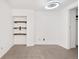 Simple bedroom with new carpet and floating shelves at 1617 California St # 3B, Denver, CO 80202