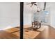 Large dining area with hardwood floors, exposed beam, a large window, and seating for four at 1617 California St # 3B, Denver, CO 80202