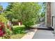 Beautiful backyard featuring patio, deck, play set, and mature trees at 4906 S Crystal St, Aurora, CO 80015