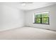 Bright bedroom with carpet and window at 4906 S Crystal St, Aurora, CO 80015