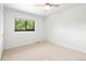 Cozy bedroom with neutral carpet, ceiling fan, and a window offering plenty of natural light at 4906 S Crystal St, Aurora, CO 80015