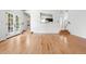 Spacious open-concept living room with hardwood floors and lots of natural light at 4906 S Crystal St, Aurora, CO 80015