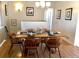 Cozy dining room with hardwood floors and a wood dining table at 5740 S Delaware St, Littleton, CO 80120
