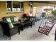 Inviting patio with wicker furniture, grill, and a relaxing porch swing perfect for outdoor living at 5740 S Delaware St, Littleton, CO 80120