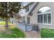 Private back patio with stone walkway and a view of the complex's exterior at 1385 W 112Th Ave # D, Denver, CO 80234