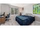 Bedroom with a large window, desk, and neutral walls at 1385 W 112Th Ave # D, Denver, CO 80234