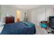 Bedroom with blue comforter, double closet, and view to ensuite bathroom at 1385 W 112Th Ave # D, Denver, CO 80234