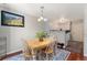 Cozy dining room with table and chairs open to the kitchen, perfect for Gathering meals at 1385 W 112Th Ave # D, Denver, CO 80234