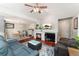Spacious living room open to the dining area, featuring a fireplace and open floor plan at 1385 W 112Th Ave # D, Denver, CO 80234