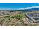 Incredible aerial view of expansive property with ponds, mature trees, multiple buildings, and a sprawling landscape at 16440 Old Denver Rd, Monument, CO 80132