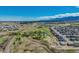 Gorgeous aerial view of expansive property with ponds, mature trees, multiple buildings, and a sprawling landscape at 16440 Old Denver Rd, Monument, CO 80132