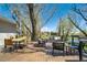 Spacious back deck with outdoor furniture and views of the surrounding trees and pond at 16440 Old Denver Rd, Monument, CO 80132