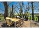 Spacious deck featuring an outdoor dining area, lounge seating, and scenic water views at 16440 Old Denver Rd, Monument, CO 80132