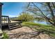 Back deck featuring scenic views of the pond, and mature trees, perfect for relaxation and enjoying nature at 16440 Old Denver Rd, Monument, CO 80132