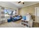 Charming bedroom with a rustic accent wall, comfortable bed, and bright window at 16440 Old Denver Rd, Monument, CO 80132