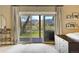 Bedroom showcasing the outdoor view from the sliding glass door to the deck at 16440 Old Denver Rd, Monument, CO 80132