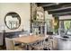 Open dining room with hardwood floors and stone fireplace at 16440 Old Denver Rd, Monument, CO 80132