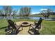 Inviting backyard fire pit with seating, ideal for outdoor gatherings with views of the nearby pond at 16440 Old Denver Rd, Monument, CO 80132