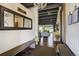 Stunning foyer featuring a hardwood floor, exposed beams, and ample natural light creating a warm welcome at 16440 Old Denver Rd, Monument, CO 80132