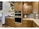 Modern kitchen with double oven, countertops, and cabinets at 16440 Old Denver Rd, Monument, CO 80132