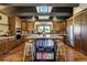 Gourmet kitchen featuring a large center island, stainless steel appliances, and skylight at 16440 Old Denver Rd, Monument, CO 80132