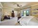 Main bedroom with deck access, barn door access to the main bathroom, and comfortable decor at 16440 Old Denver Rd, Monument, CO 80132