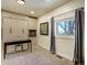 Bright home office featuring a built-in Murphy bed, a desk, and a large window with natural light at 16440 Old Denver Rd, Monument, CO 80132