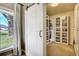 Walk-in closet with shoe racks and a sliding barn door for easy access at 16440 Old Denver Rd, Monument, CO 80132