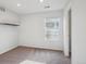 Neutral bedroom featuring plush carpet, bright window, recessed lighting, and a wall mounted shelf at 2533 Central Park Blvd, Denver, CO 80238