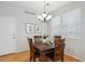 Charming dining room with hardwood floors, wooden table, and natural light at 2533 Central Park Blvd, Denver, CO 80238