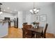 Dining room with a kitchen view featuring a dark wood table with seating at 2533 Central Park Blvd, Denver, CO 80238