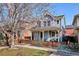 Charming two-story home with a welcoming front porch and well-maintained yard at 2533 Central Park Blvd, Denver, CO 80238