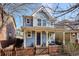 Inviting two-story home with a cozy front porch and a quaint fenced yard at 2533 Central Park Blvd, Denver, CO 80238