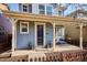 The covered front porch features stylish decor and a comfortable seating area at 2533 Central Park Blvd, Denver, CO 80238