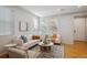 Bright living room with hardwood floors, contemporary decor, and comfortable seating at 2533 Central Park Blvd, Denver, CO 80238