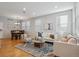 Bright living room featuring hardwood floors and comfortable seating arrangements at 2533 Central Park Blvd, Denver, CO 80238