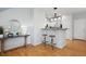 Open living area showcasing a breakfast bar and hardwood flooring at 2533 Central Park Blvd, Denver, CO 80238