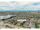 Aerial view of the community, showing home at 3386 Valentia Street in relation to the city and nearby mountains at 3386 Valentia St, Denver, CO 80238