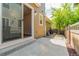 Concrete back patio with a view of the backyard, sliding glass door, and wooden fence at 3386 Valentia St, Denver, CO 80238