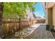 A fenced backyard featuring a paved area perfect for outdoor seating and entertaining at 3386 Valentia St, Denver, CO 80238