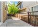 Cozy backyard with concrete patio, wooden fence, and stone landscaping at 3386 Valentia St, Denver, CO 80238