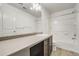 Bathroom featuring a single sink, vanity with storage, and a shower-tub combination at 3386 Valentia St, Denver, CO 80238