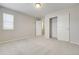 Neutral bedroom with closet and window providing lots of natural light and closet space at 3386 Valentia St, Denver, CO 80238