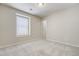 Bedroom with soft carpet, neutral walls, and a window with blinds at 3386 Valentia St, Denver, CO 80238