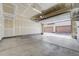 Spacious two car garage with high ceilings and concrete floors ready for your vehicles and storage at 3386 Valentia St, Denver, CO 80238
