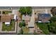 Aerial view of a residential property with a well-maintained backyard, surrounded by lush greenery and neighboring homes at 1229 W 102Nd Ave, Northglenn, CO 80260