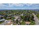 Scenic aerial view capturing a quiet residential neighborhood with tree-lined streets and distant mountain views at 1229 W 102Nd Ave, Northglenn, CO 80260