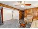 Finished basement with wood paneling, plush carpet, and a stairway at 1229 W 102Nd Ave, Northglenn, CO 80260